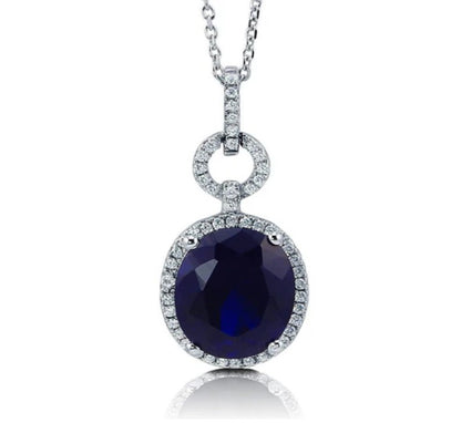 Halo Simulated Blue Sapphire Oval CZ Necklace in Sterling Silver