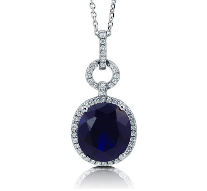 Halo Simulated Blue Sapphire Oval CZ Necklace in Sterling Silver